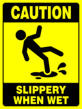 Yellow safety sign with black text and icon indicating caution and slippery when wet conditions.