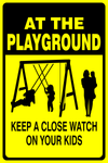 At the playground : Keep a close watch on your kids safety sign (NOT095)