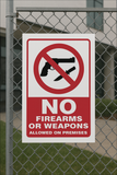 No Firearms or weapons allowed on premises safety sign (NWE02)